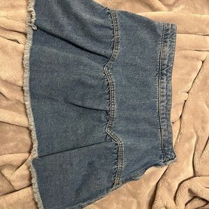 Francesca’s denim Mini Skirt with Frayed Hem